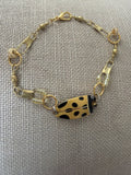 gold tone chain bracelet with fish charm