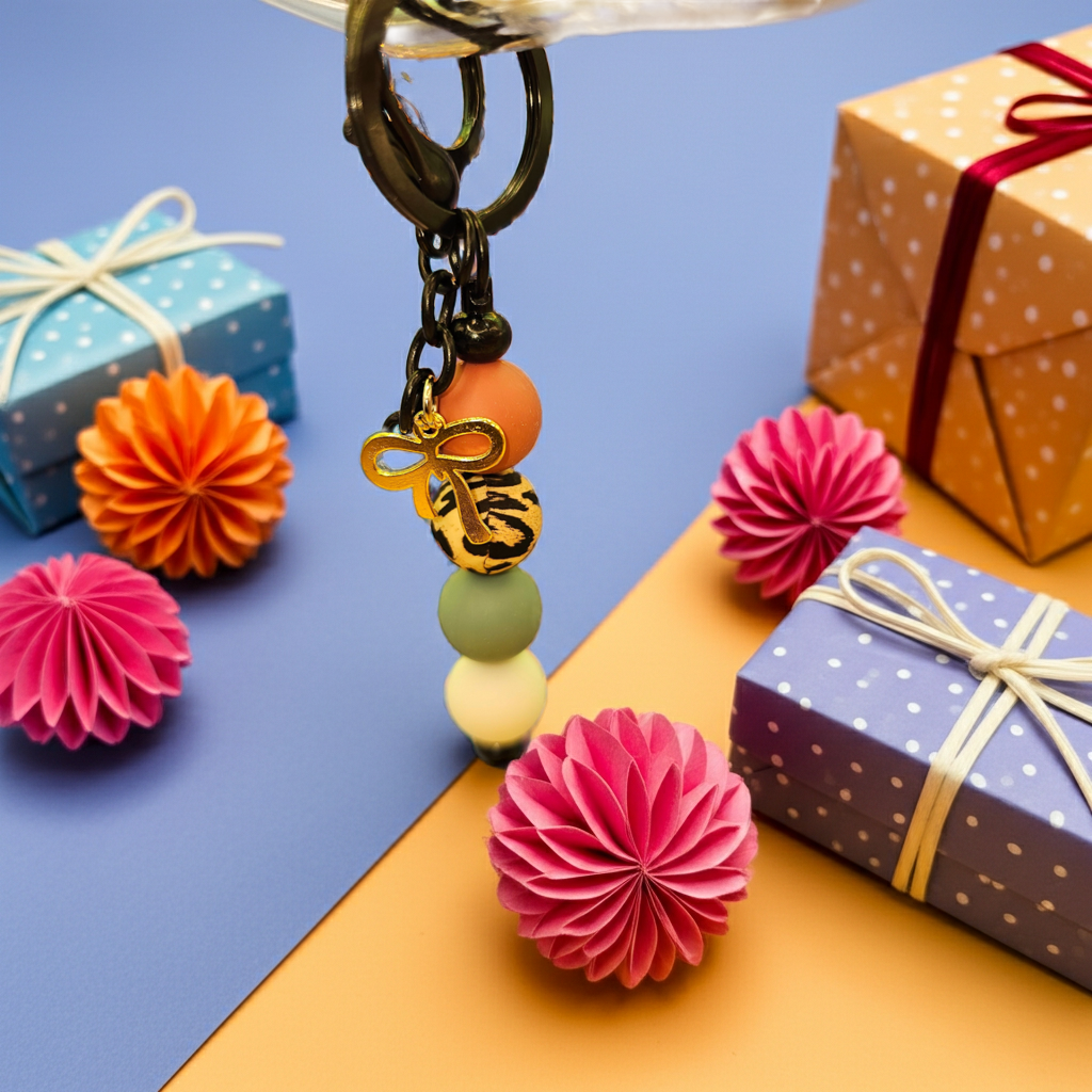 Introducing our stunning handmade gold bow charm keychain with colorful beads, a delightful accessory 